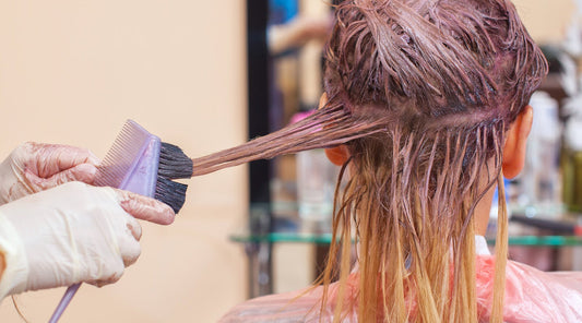 Woman getting coloring service on hair extensions - Why Coloring Your Hair Extensions Changed the Texture – And How to Prevent It