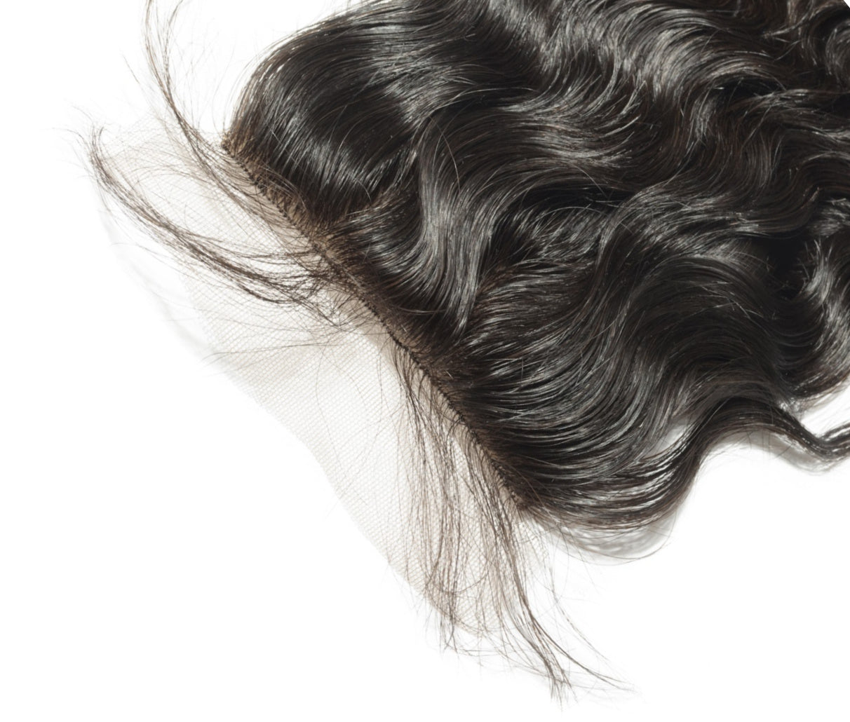 Raw Indian Lace Closure Close-up of curly wavy hair on a white background