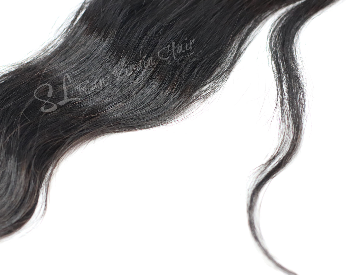 This is up close texture shot of SL Raw Natural Wavy I tip hair extensions. These tips can be used for micro links, Fusions, or Brazilian knotting. Hair texture matches great with 2A-2c hair types 50 pcs