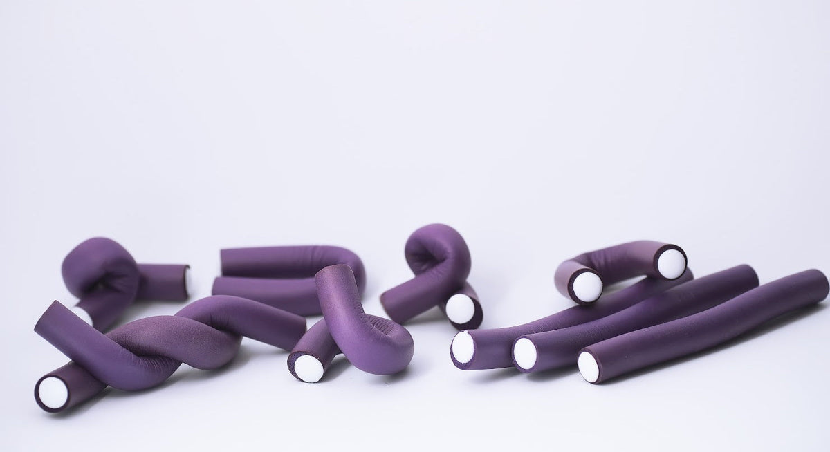 Purple flexi rods for creating heatless curls on natural hair