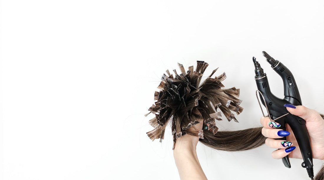 Woman holding k-tips: Micro Links vs. Fusion Hair Extensions: Which is Right for You?