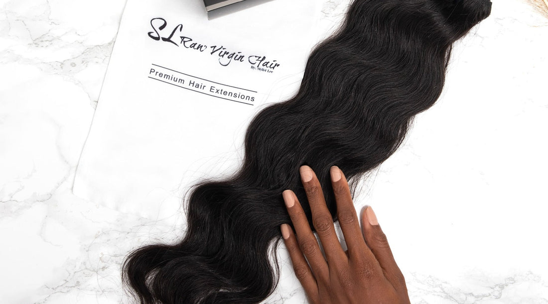 Woman touching authentic raw human hair extensions with SL Raw Virgin Hair Branding 