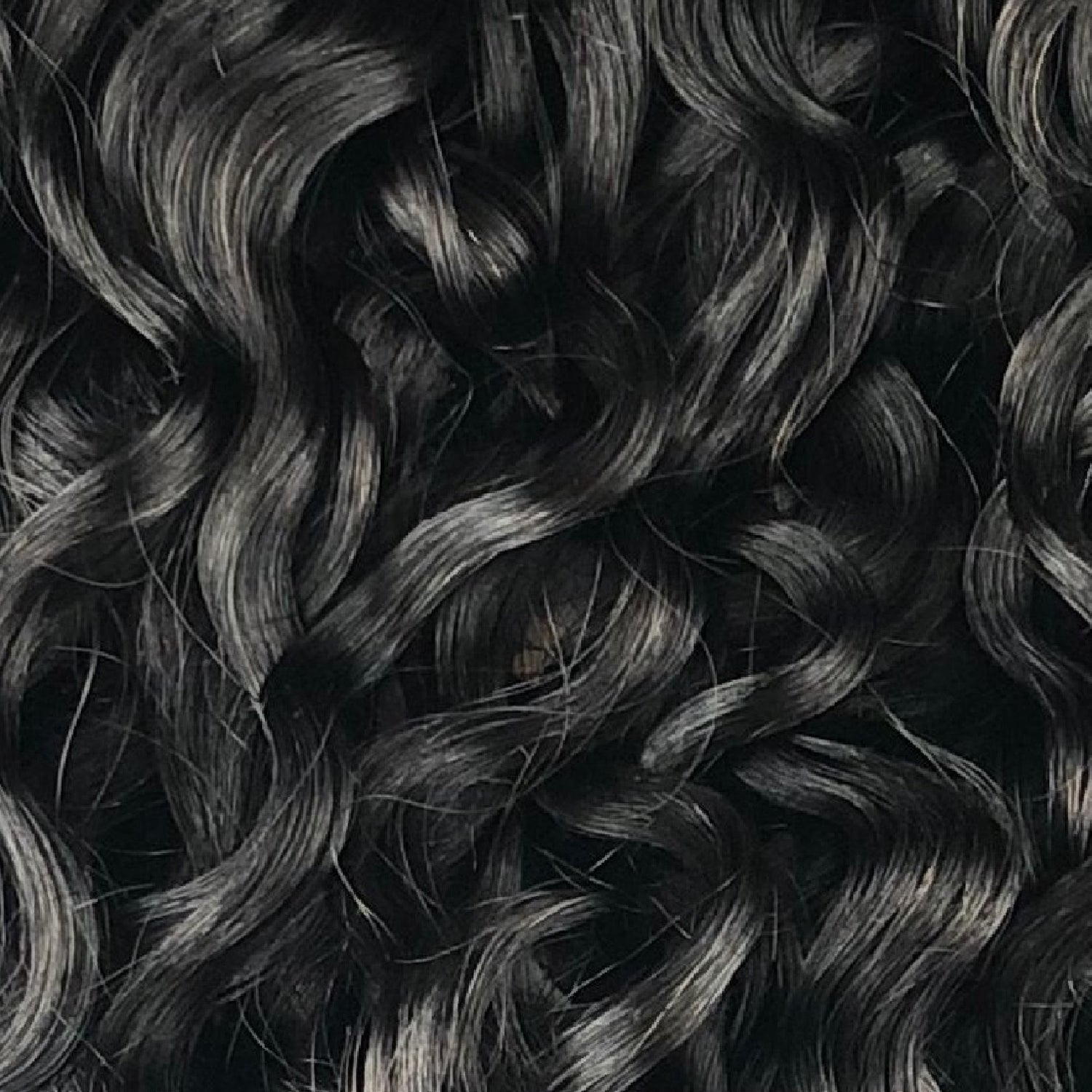 Close up shot of curly hair extensions