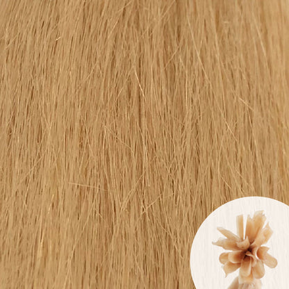 Close-up of light golden blonde straight hair extensions with a small circular inset showing the K-Tip bundle attachment tip.
