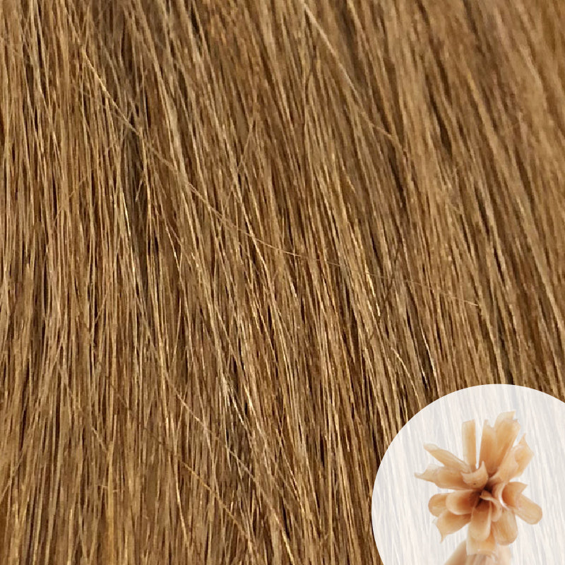 Close-up of pepper blonde light brown straight hair extensions with a small circular inset showing the K-Tip bundle attachment tip.