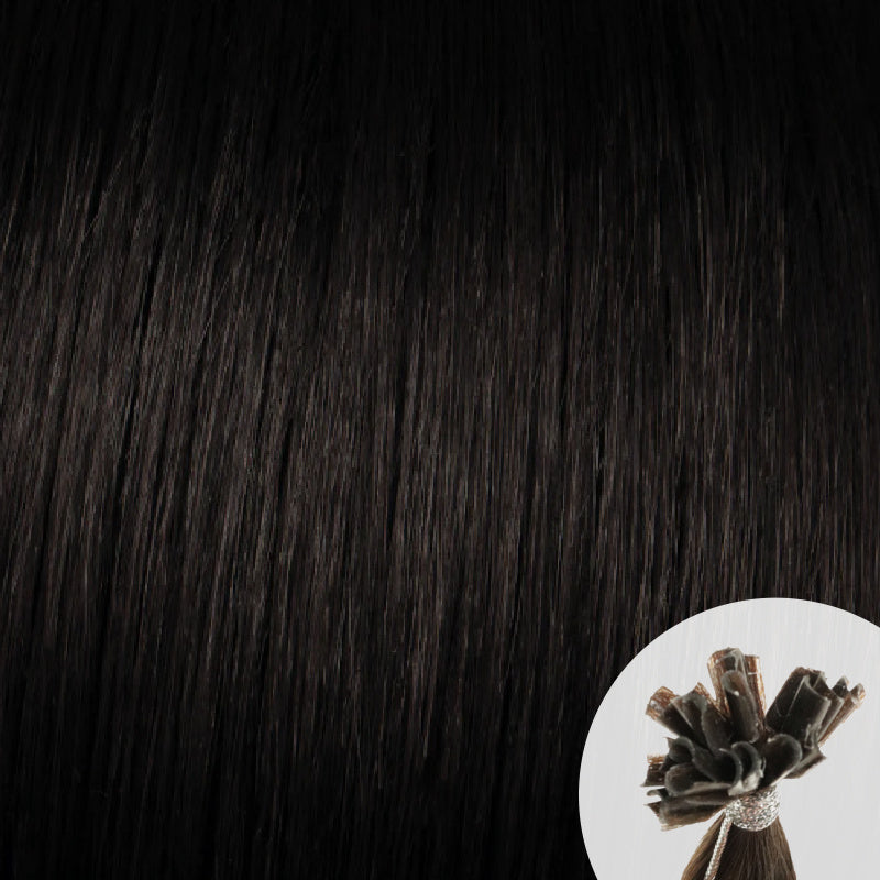 Close-up of natural black straight hair extensions with a small circular inset showing the K-Tip bundle attachment tip.