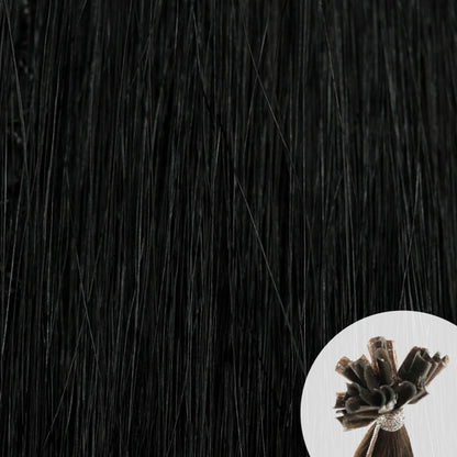 Close-up of jet black straight hair extensions with a small circular inset showing the K-Tip bundle attachment tip.