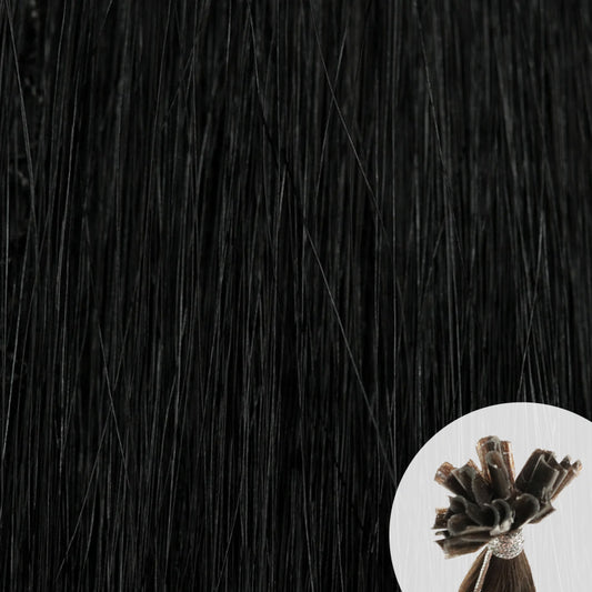 Close-up of jet black straight hair extensions with a small circular inset showing the K-Tip bundle attachment tip.