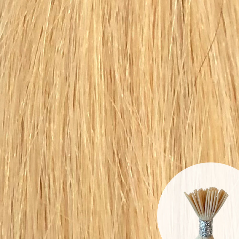 Light golden blonde seamless I-tip hair extensions with a circular inset showing an up-close bundle of the i-tip hair strands on a white background.