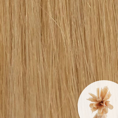 Close-up of yellow blonde straight hair extensions with a small circular inset showing the K-Tip bundle attachment tip.