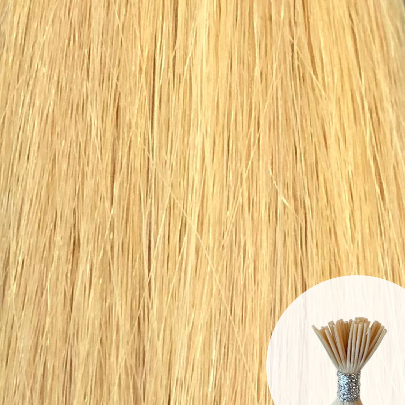 Light golden blonde seamless I-tip hair extensions with a circular inset showing an up-close bundle of the i-tip hair strands on a white background.