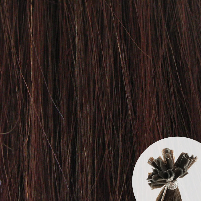 Close-up of dark brown reddish straight hair extensions with a small circular inset showing the K-Tip bundle attachment tip.