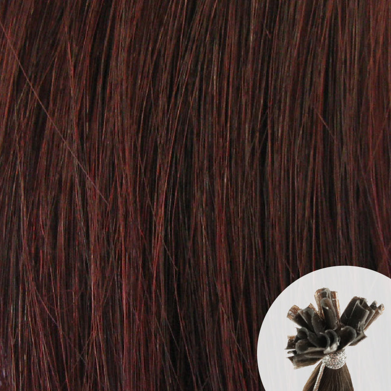 Close-up of wine dark reddish straight hair extensions with a small circular inset showing the K-Tip bundle attachment tip.