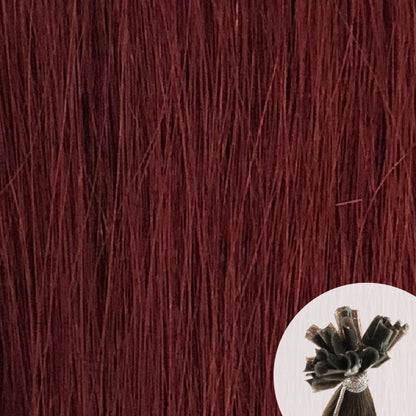 Close-up of mahogany "deep burgundy" straight hair extensions with a small circular inset showing the K-Tip bundle attachment tip.