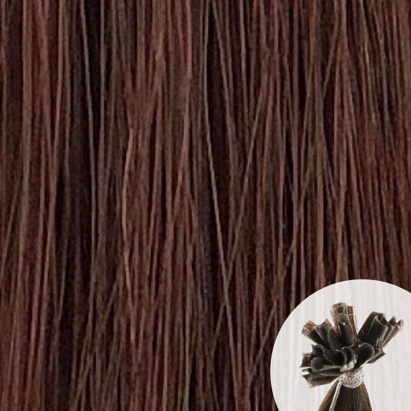 Close-up of chestnut brown straight hair extensions with a small circular inset showing the K-Tip bundle attachment tip.