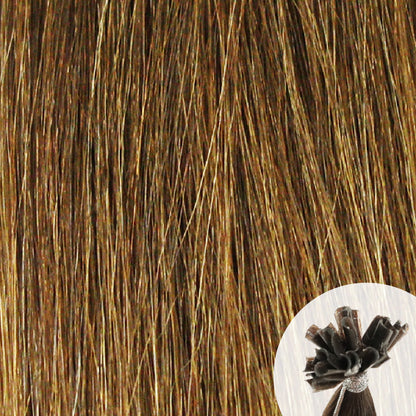 Close-up of golden brown straight hair extensions with a small circular inset showing the K-Tip bundle attachment tip.