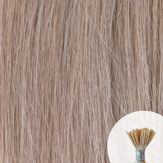 Silver Ash Blonde seamless I-tip hair extensions with a circular inset showing an up-close bundle of the i-tip hair strands on a white background.