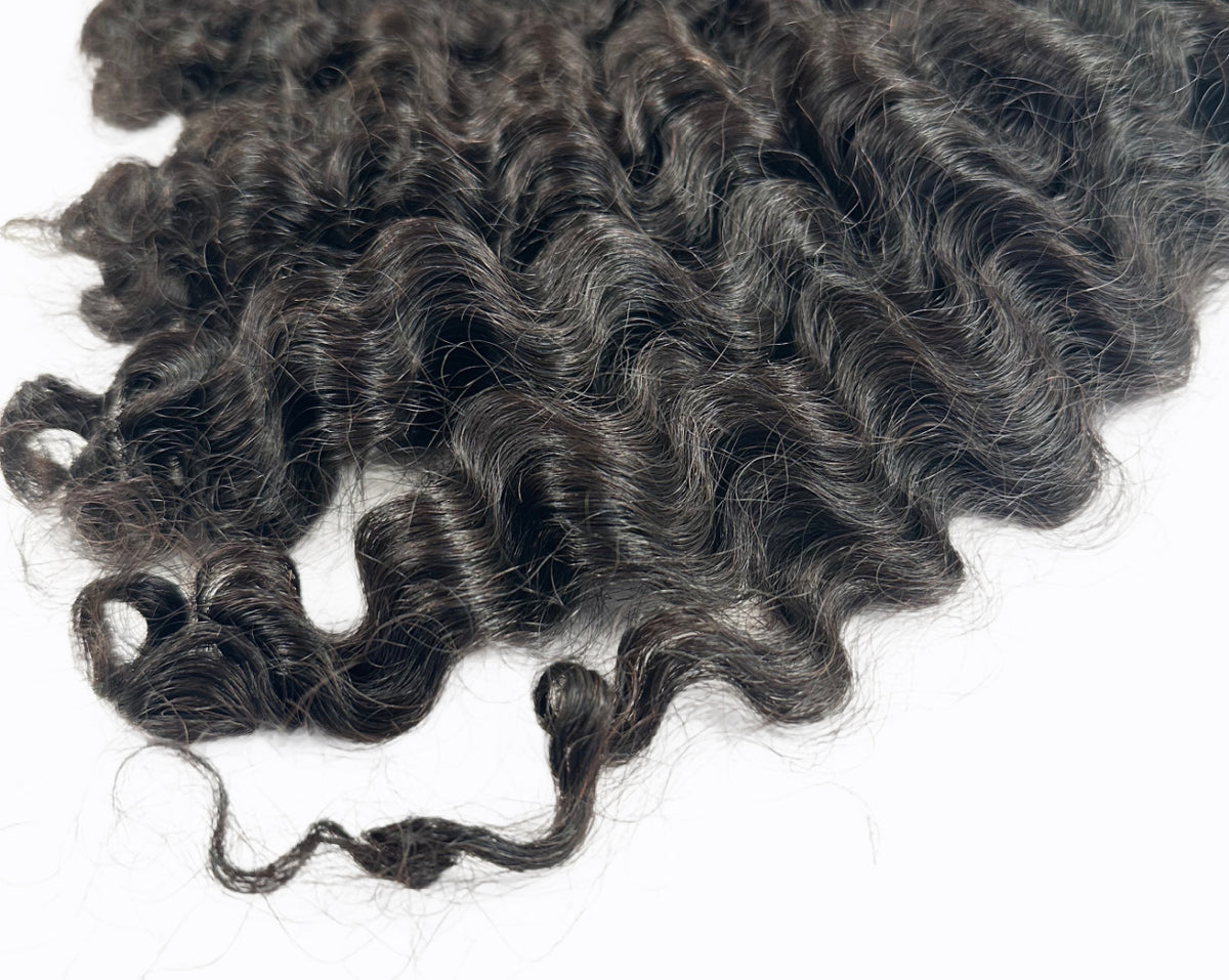 Image of Burma hair curly swatch matches curl patter 3a-3c. Perfect curly for any season. Ony sold by SL Raw Virgin Hair in 100 gram bundles. SL Raw Virgin hair 