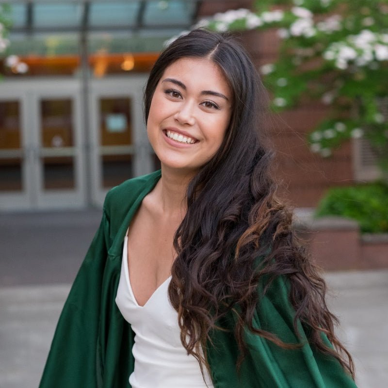 Woman smiles in hair extensions for graduation 
