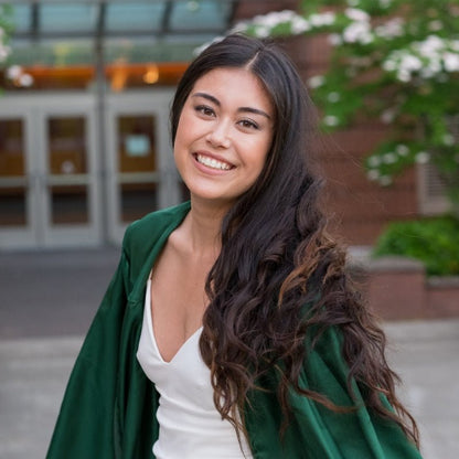 Woman smiles in hair extensions for graduation 