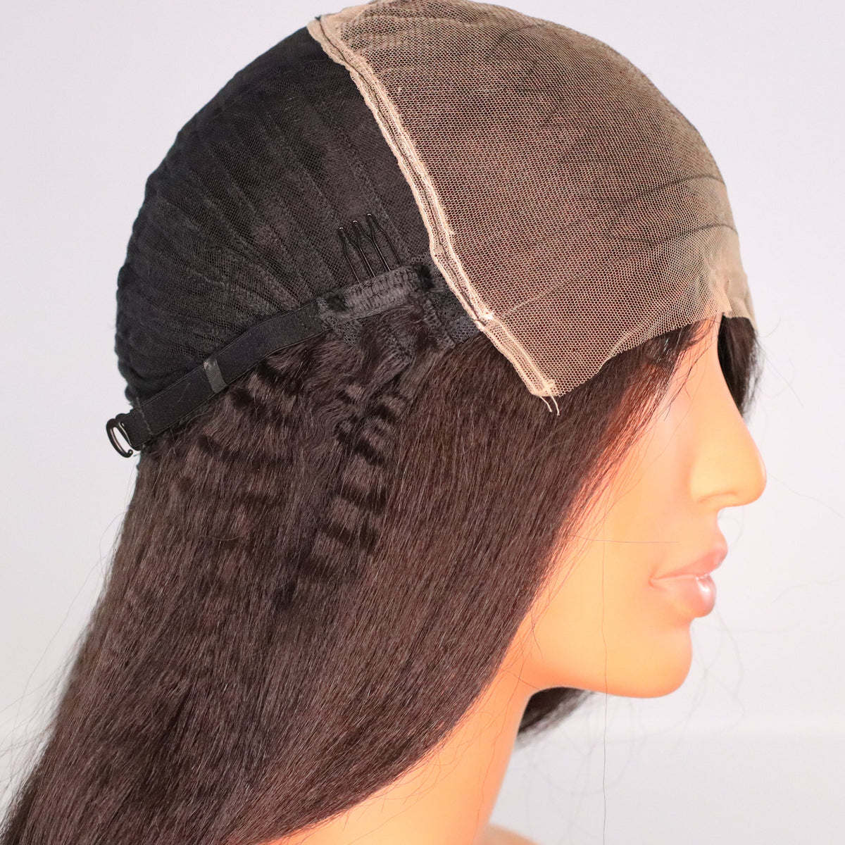 Side interior view of Kinky Straight human hair wig showing 7x7 HD lace, comb and adjustable cap