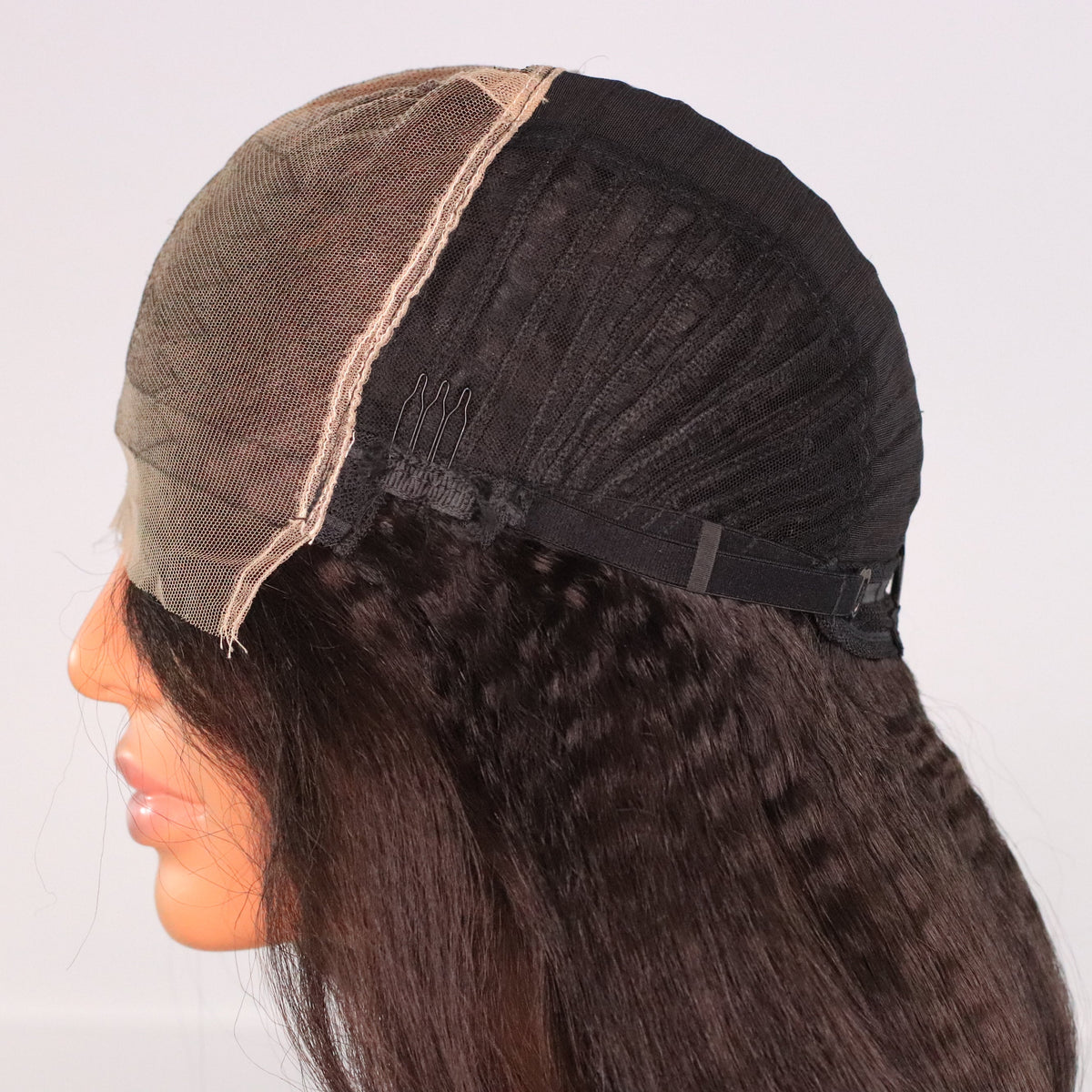 Interior side view of Kinky Straight wig showing 7x7 HD lace, ventilated cap, comb and adjustable strap