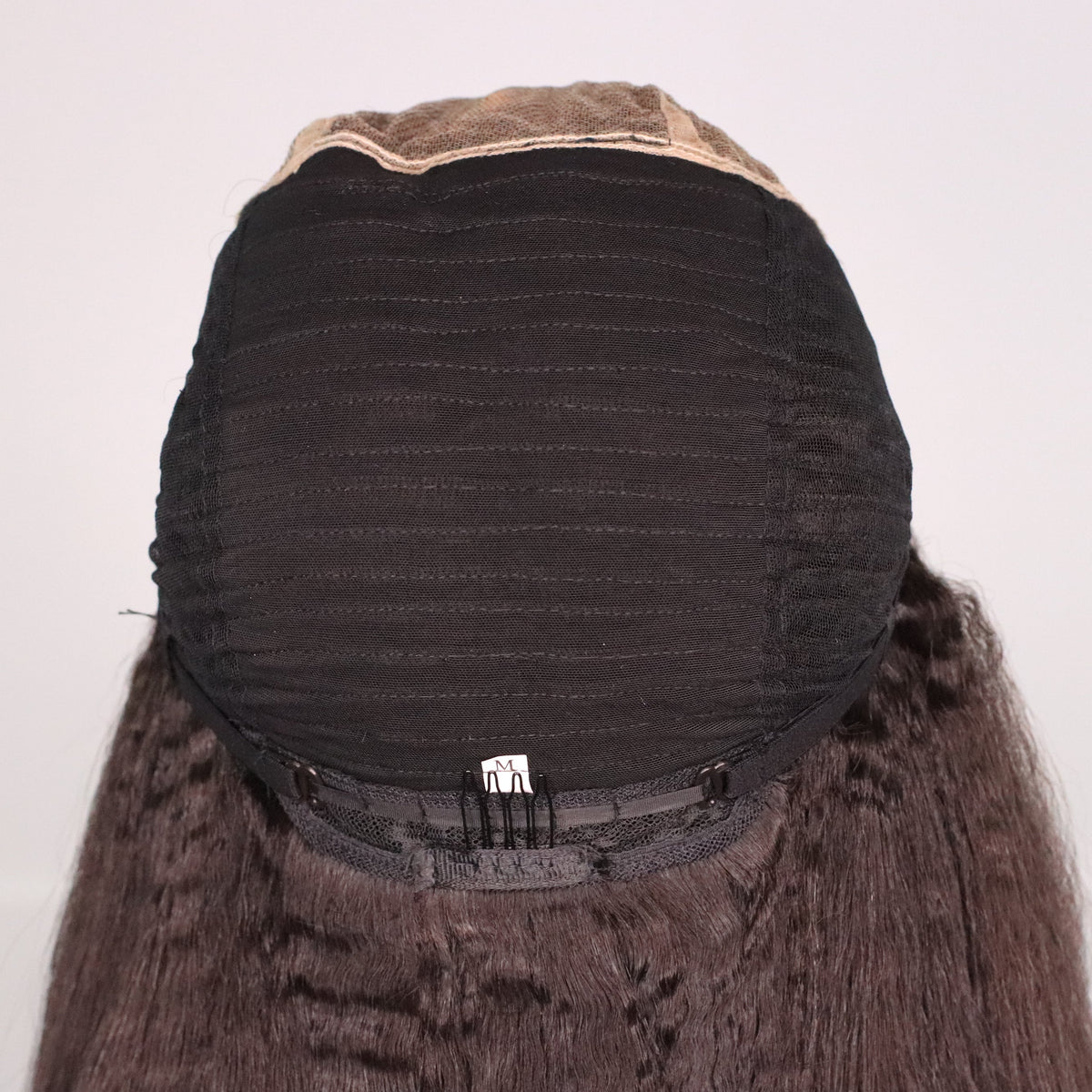 Back interior of Kinky Straight human hair wig showing ventilated cap, rear comb and adjustable straps