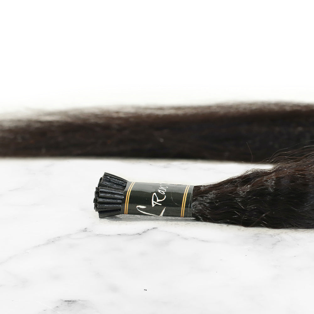 Displayed is keratin I-tip Kinky Straight I-tip Bundle of 50 links in Natural Black #1B by SL Raw Virgin Hair . Hair is ised for micro links and fusions. Great for natural hair women