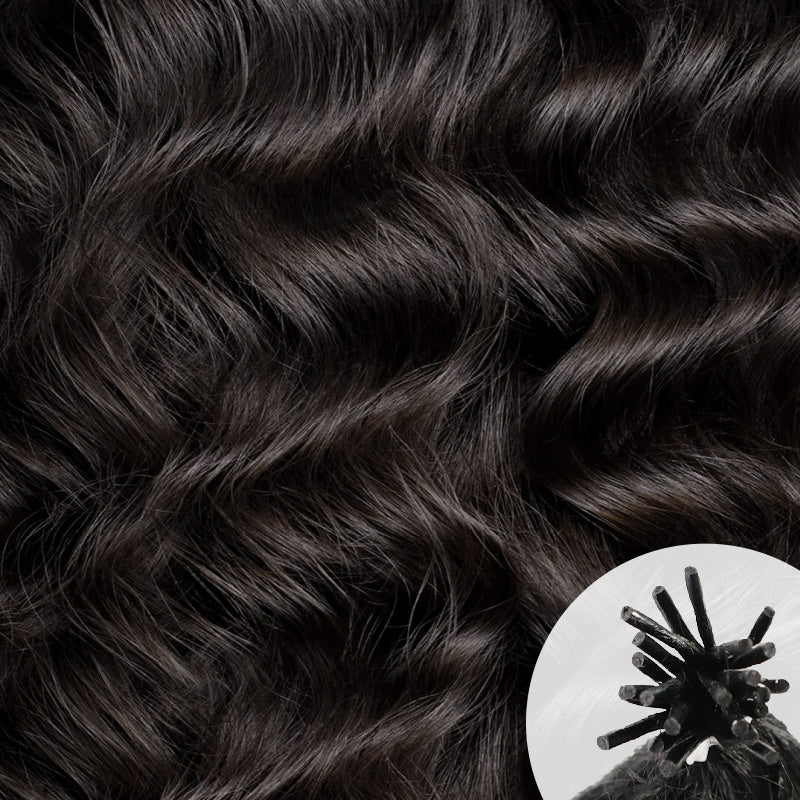 Close-up of dark brown to near-black Lao Curly 3A hair texture, with a small circular inset in the lower right showing a traditional I-tip hair extension.