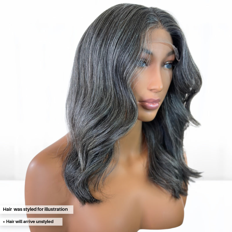 Side view. Beautiful Natural looking gray hair salt and pepper Fit 'N' Go Wig in 14-inches. Glue less wig. Cut into Long Layers for mature women. Thick and fully made of Raw Vietnamese human hair. For medium head sizes 22inch circumference. Crafted with precision cutting layers for a tussle finish