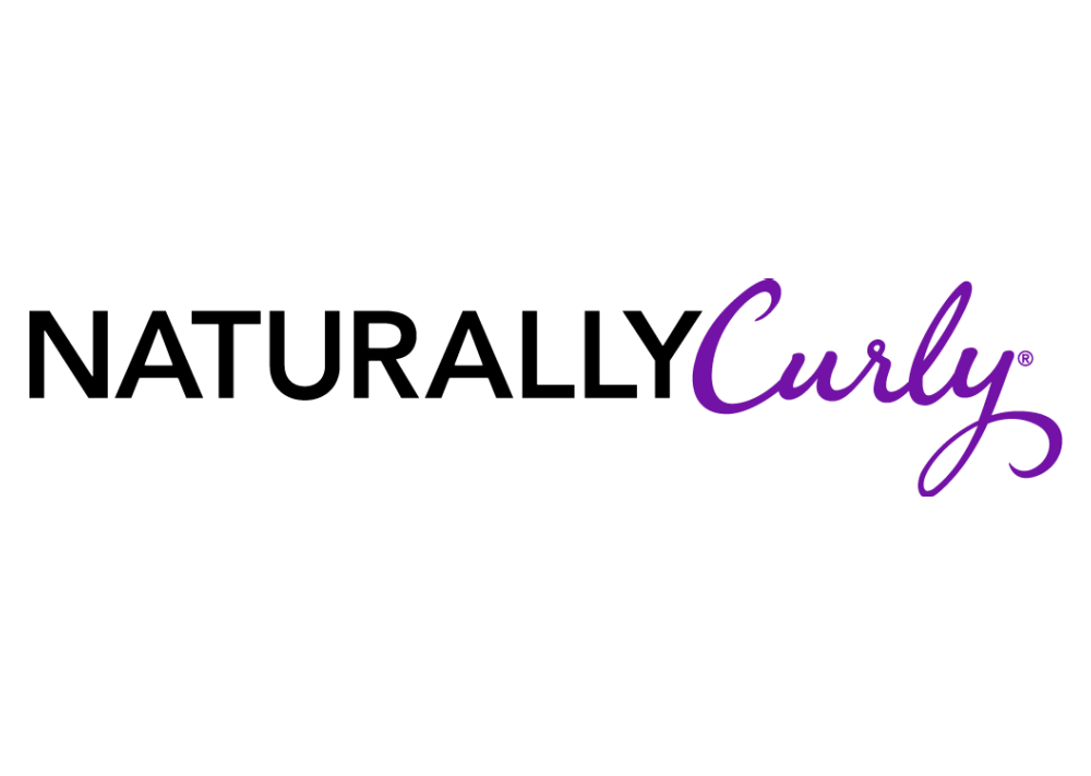 Naturally Curly logo in purple and white, signifying SL Raw Virgin Hair's mention in NaturallyCurly.com.