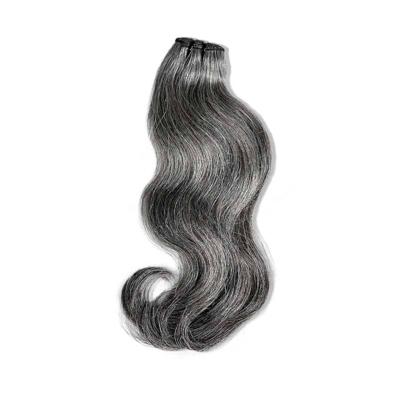 Displayed is SL Raw Virgin Hair Salt and Pepper gray hair vietnamese human hair bundles with a slight wave. beautiful hair wefts for a perfect sew in or pronto weave