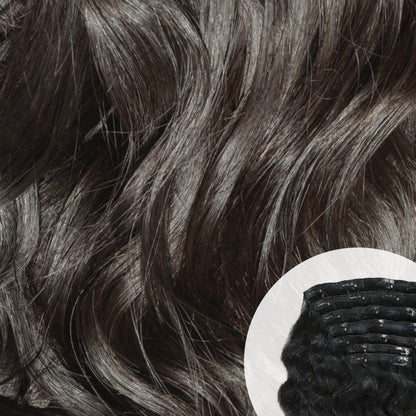 Close-up of Raw Indian curly clip-in hair extensions with a small comb inset. SL Raw Virgin Hair 