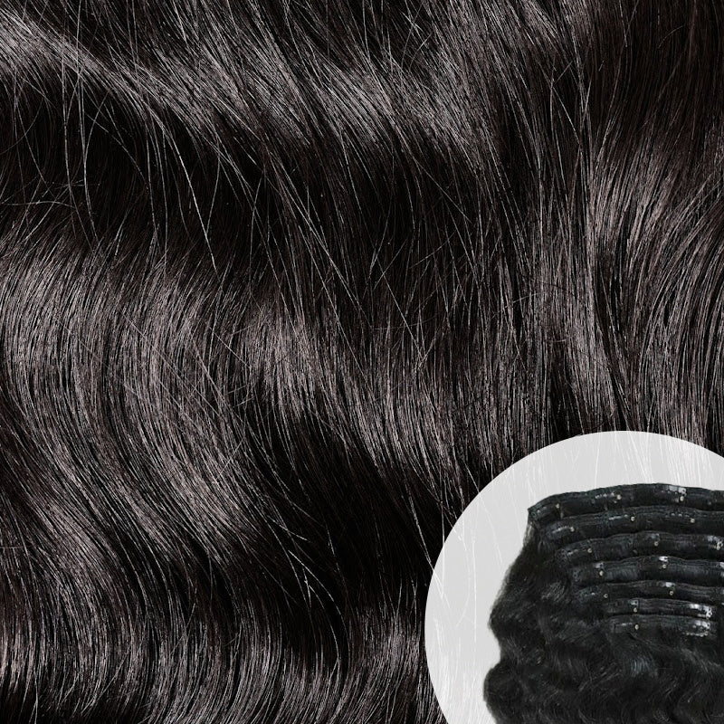 Close-up of natural black Raw Indian Wavy Clip-in hair extensions with a clip. SL Raw Virgin Hair.