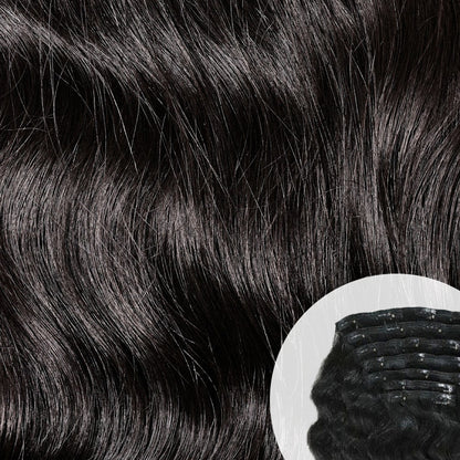 Close-up of natural black Raw Indian Wavy Clip-in hair extensions with a clip. SL Raw Virgin Hair.