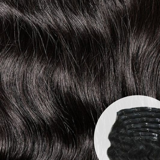 Close-up of natural black Raw Indian Wavy Clip-in hair extensions with a clip. SL Raw Virgin Hair.