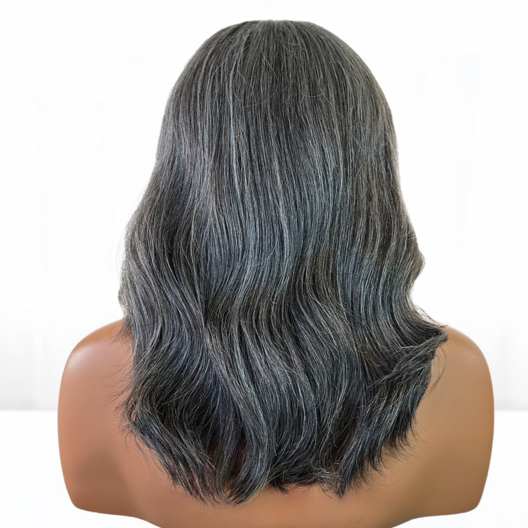 Back View. Real Natural looking gray hair salt and pepper Fit 'N' Go Wig in 14-inches. Cut into Long Layers for mature women. Thick and fully made of Raw Vietnamese human hair. For medium head sizes 22inch circumference. Crafted with precision cutting layers for a tussle finish