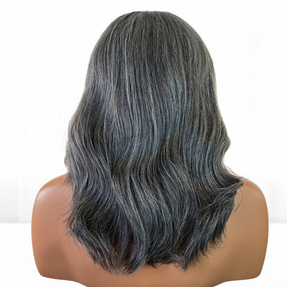 Back View. Real Natural looking gray hair salt and pepper Fit 'N' Go Wig in 14-inches. Cut into Long Layers for mature women. Thick and fully made of Raw Vietnamese human hair. For medium head sizes 22inch circumference. Crafted with precision cutting layers for a tussle finish