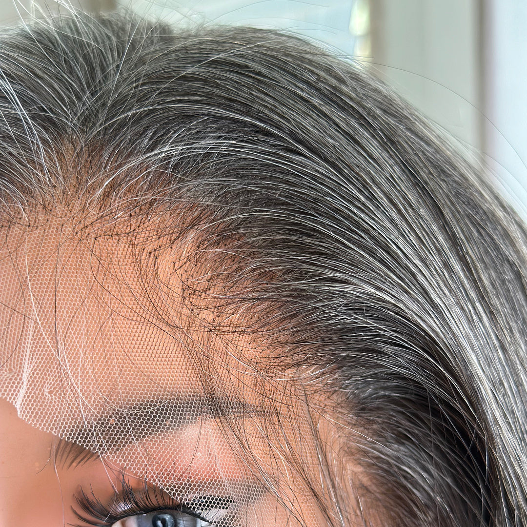 Beautiful Salt and Pepper gray hair human hair lace front wig hairline upclose and natural looking. Single hair knot craftsmanship. Made for older women with natural hair gray.