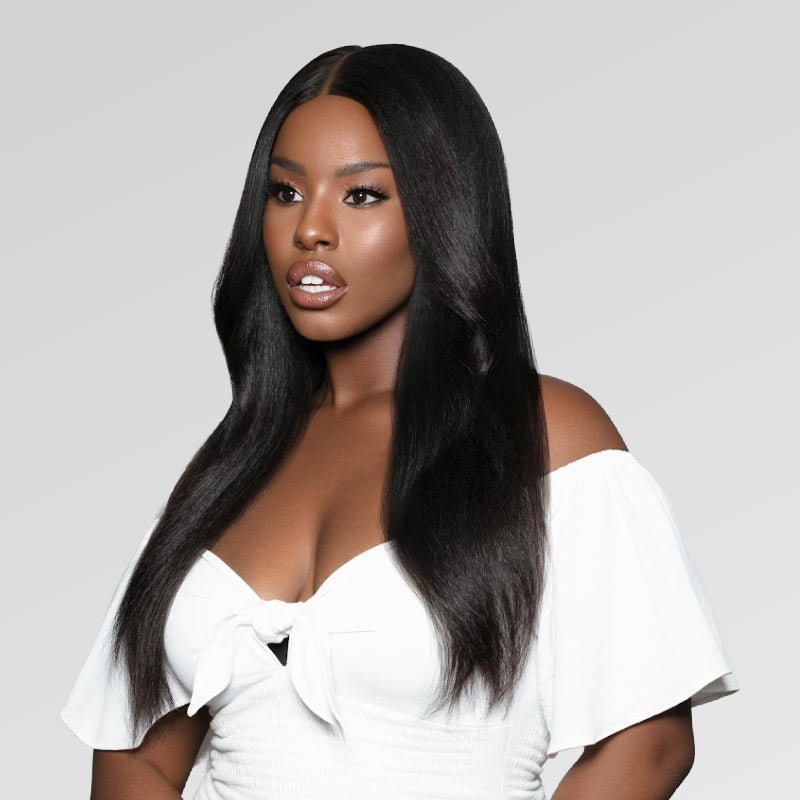 Young Black Woman wearing natural looking textured hair extension’s from SL Raw Brazilian Kinky Straight Hair. Length in 18-inches. This hair matches blow-out hair by African American women.