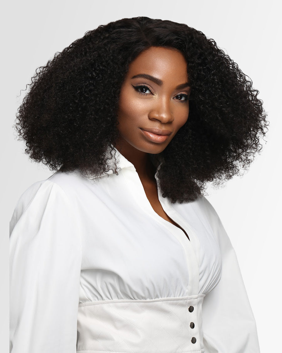 Woman wearing coily textured human hair extensions