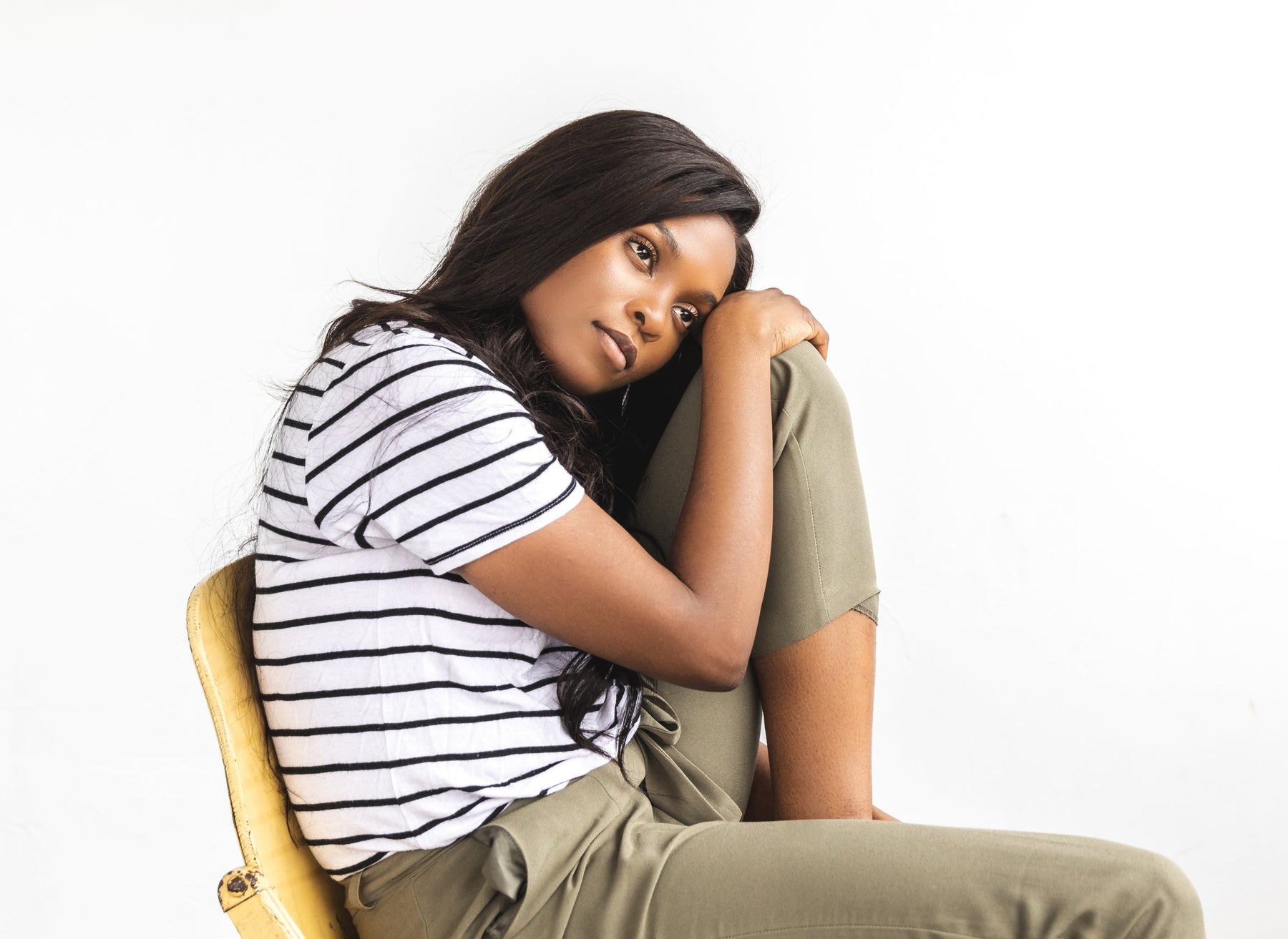 Image of woman making a hair extension decision. Which method to choose 