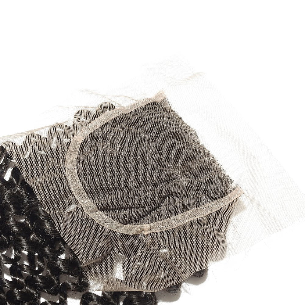 Close-up of a kinky curly hair extension with a clear mesh cover on a white background