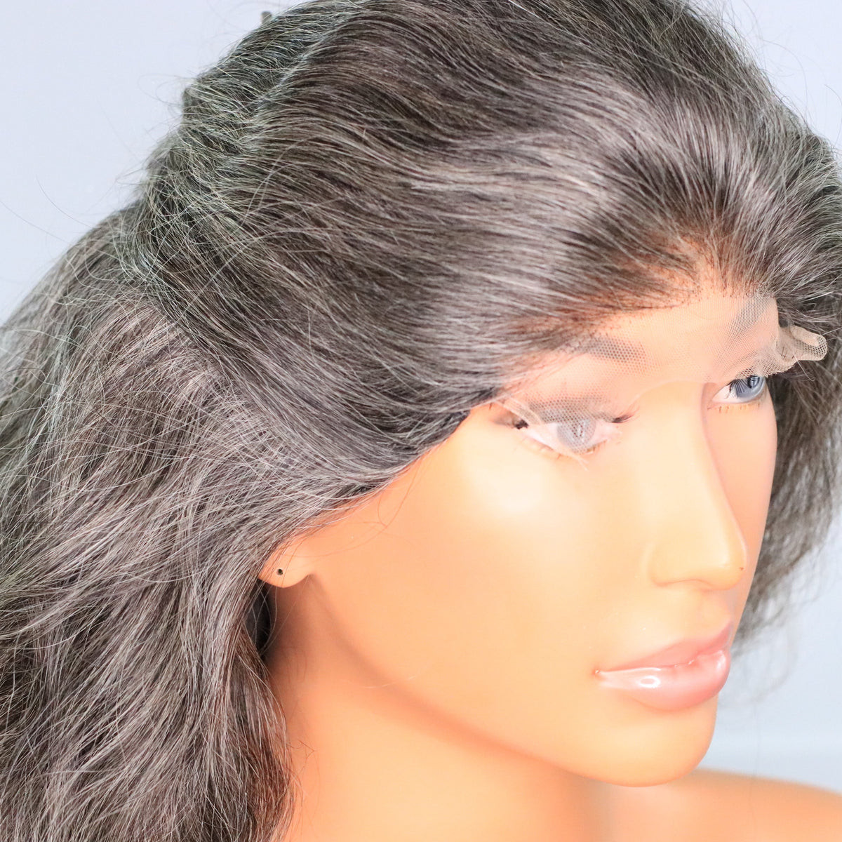 Natural gray salt-and-pepper human hair wig showing the HD lace hairline and gray color variation