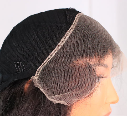 Close-up of Natural Wavy human hair wig showing the HD lace front, hairline and lace construction