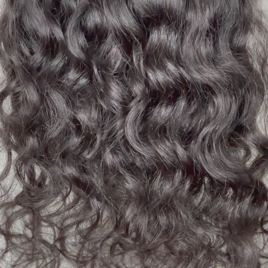 Raw Indian curly hair clip-in hair extensions freshly washed with soft movement. Sold at SL Raw Virgin Hair