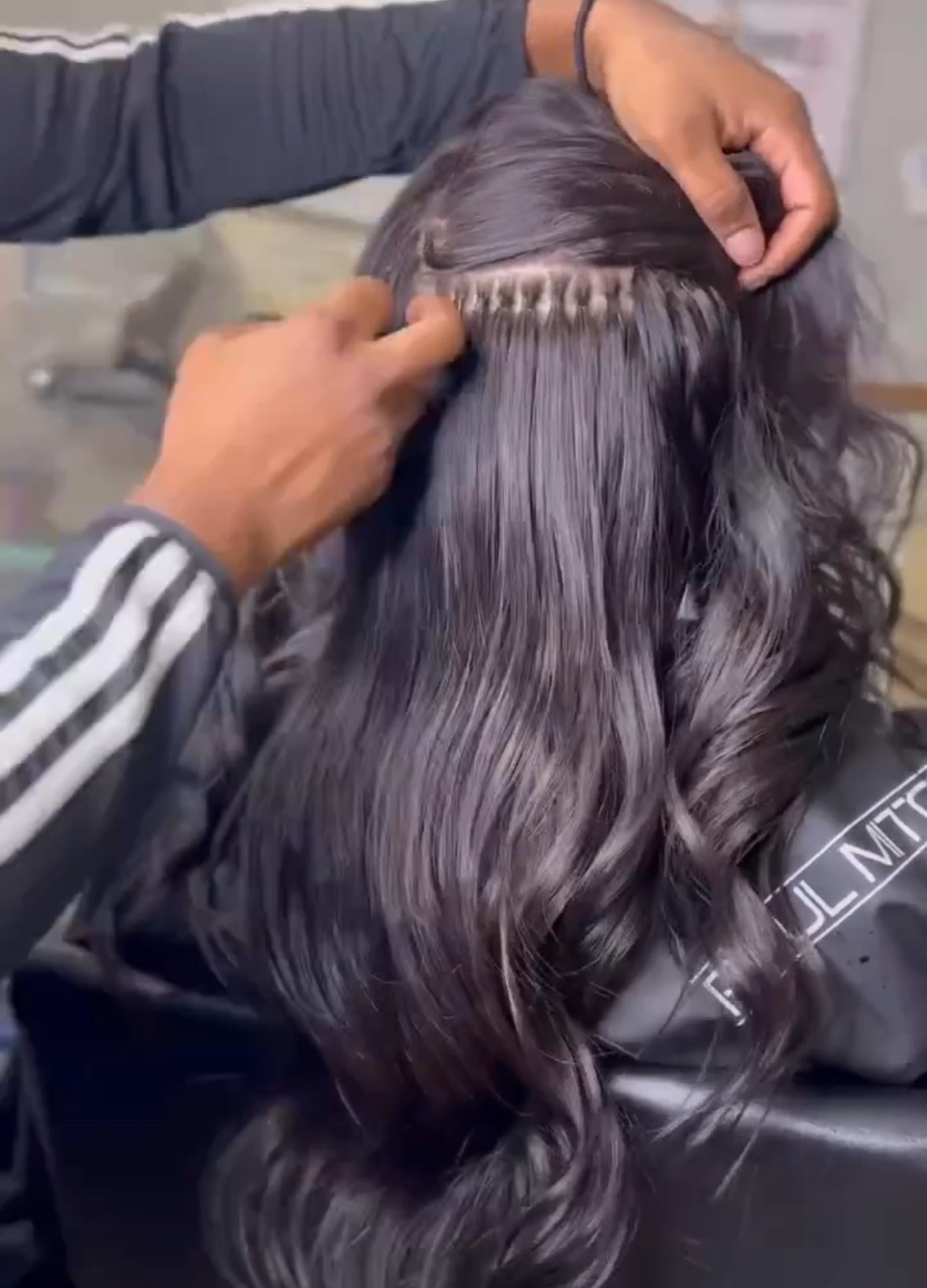 Video of Woman wearing 250 pcs of Seamless I-tips in Natural Black for Micro-link hair extensions by SL Raw Virgin Hair. Installed by Sacremento Hairstylist  @Eyaleslays