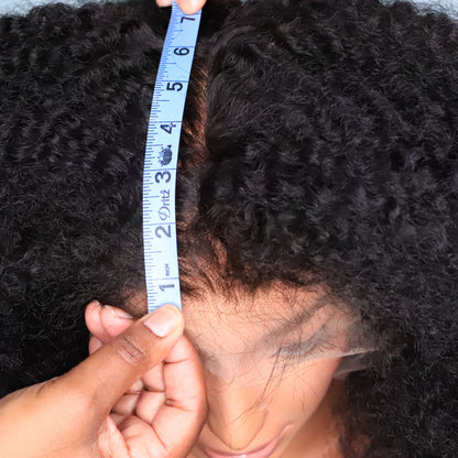 Soft Kinky Curly lace front wig with measuring tape demonstrating six inches of parting depth within the 13x6 frontal lace