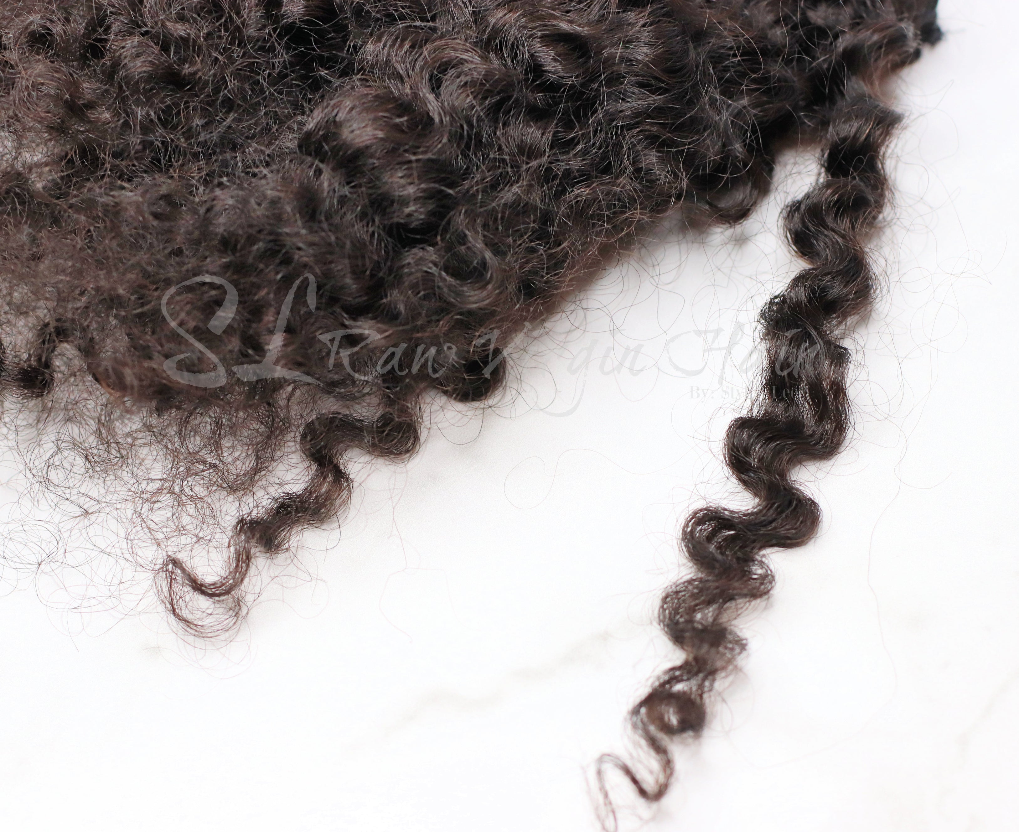 Image of Burma hair curly swatch matches curl patter 3a-3c. Perfect curly for any season. Ony sold by SL Raw Virgin Hair in 100 gram bundles. SL Raw Virgin hair 