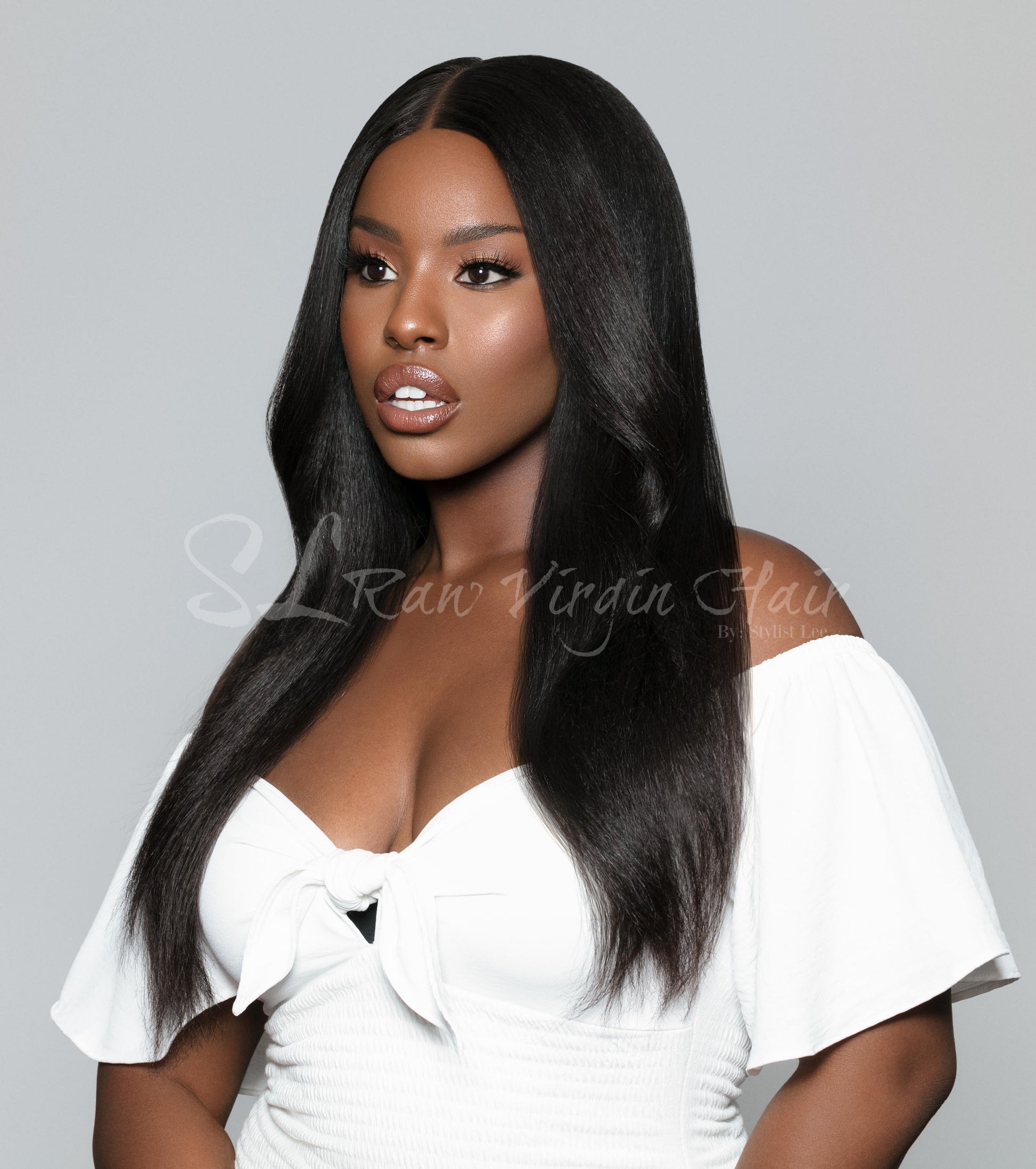 Side hair view of SL Raw Girl Model wearing 18" Kinky Straight Natural Black Lace Closure wig with a 7x7 Lace closure. Free parting hair. Beautiful natural hairline. Lace closure Wig so easy to apply on for everyday wear.